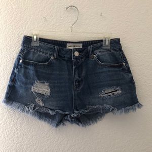 Navy blue ripped jean shorts.
